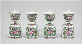Group of Four Chinese Enameled Porcelain Candlesticks