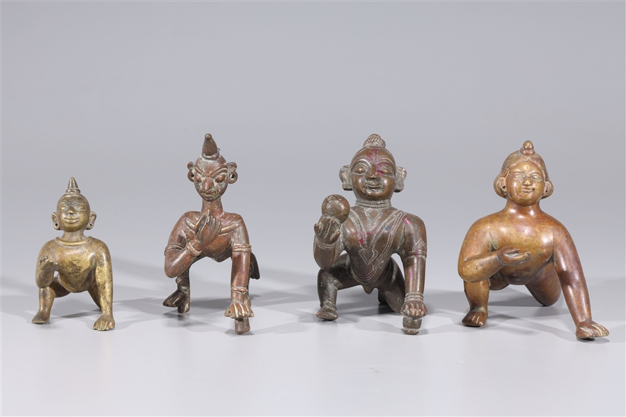 Group of Four Antique Indian Crawling Bala Krishna Statues