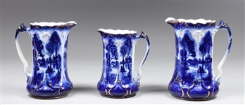 Group of Three Antique Flow Blue Pitchers